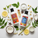 Tamed Organics scabies treatment products — Extreme Scabies Relief Cream and Scabies Body Wash & Shampoo — surrounded by natural ingredients including neem leaves, lemon, coconut, chamomile, cloves, and lemongrass on a white background